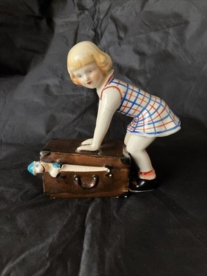 1950s  Little Girl Closing Suitcase  Japanese Copy of Dakon Sculpture Porcelain