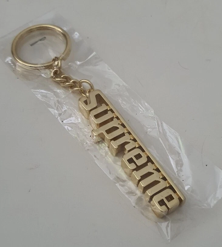 Porte clés métal doré FW16 Supreme Grand Prix accessoire neuf et non ouvert 