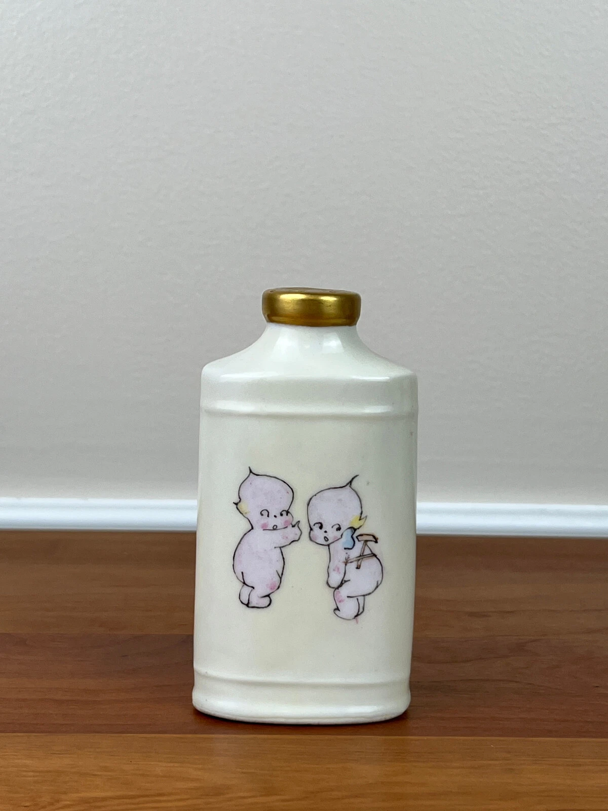 Antique KEWPIE Talc Baby Powder 4 ⅝” Porcelain Bottle
Opens in a new window or tab