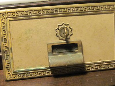 Metal industrial post office box front with keys