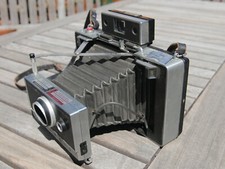 Polaroid Land Camera Automatic 100 with Instruction Book, Cold Clip and Strap