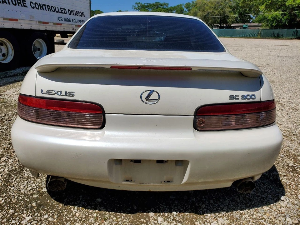 Lexus SC300 1997 2000 alerón trasero OEM con herrajes necesita pintura Foto 2 de 4