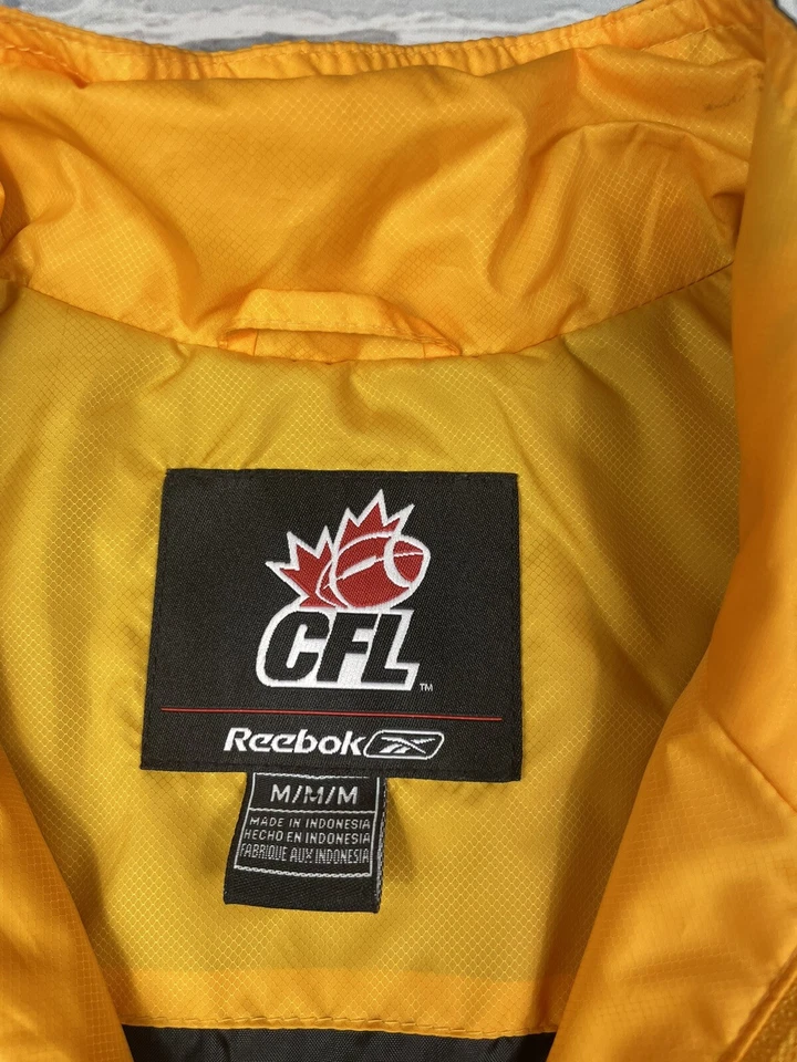 Chaqueta CFL Hamilton Tiger-Cats Reebok 1/4 Cremallera De Colección Negra y Dorada Para Hombre Talla M Foto 4 de 4