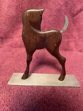 Bambi likeness mid century, made of walnut and aluminum.   Purchased in Orlando