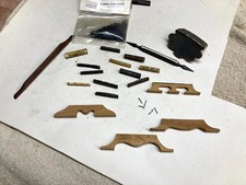 vintage banjo  mandolin parts lot Nuts bridges, 5th st. spikes, TPC parts etc