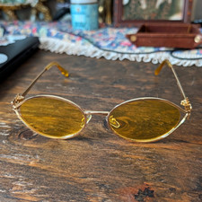 Miu Miu Women  s Rimless Oval Sunglasses Gold Metal Frame Yellow Tinted Lenses