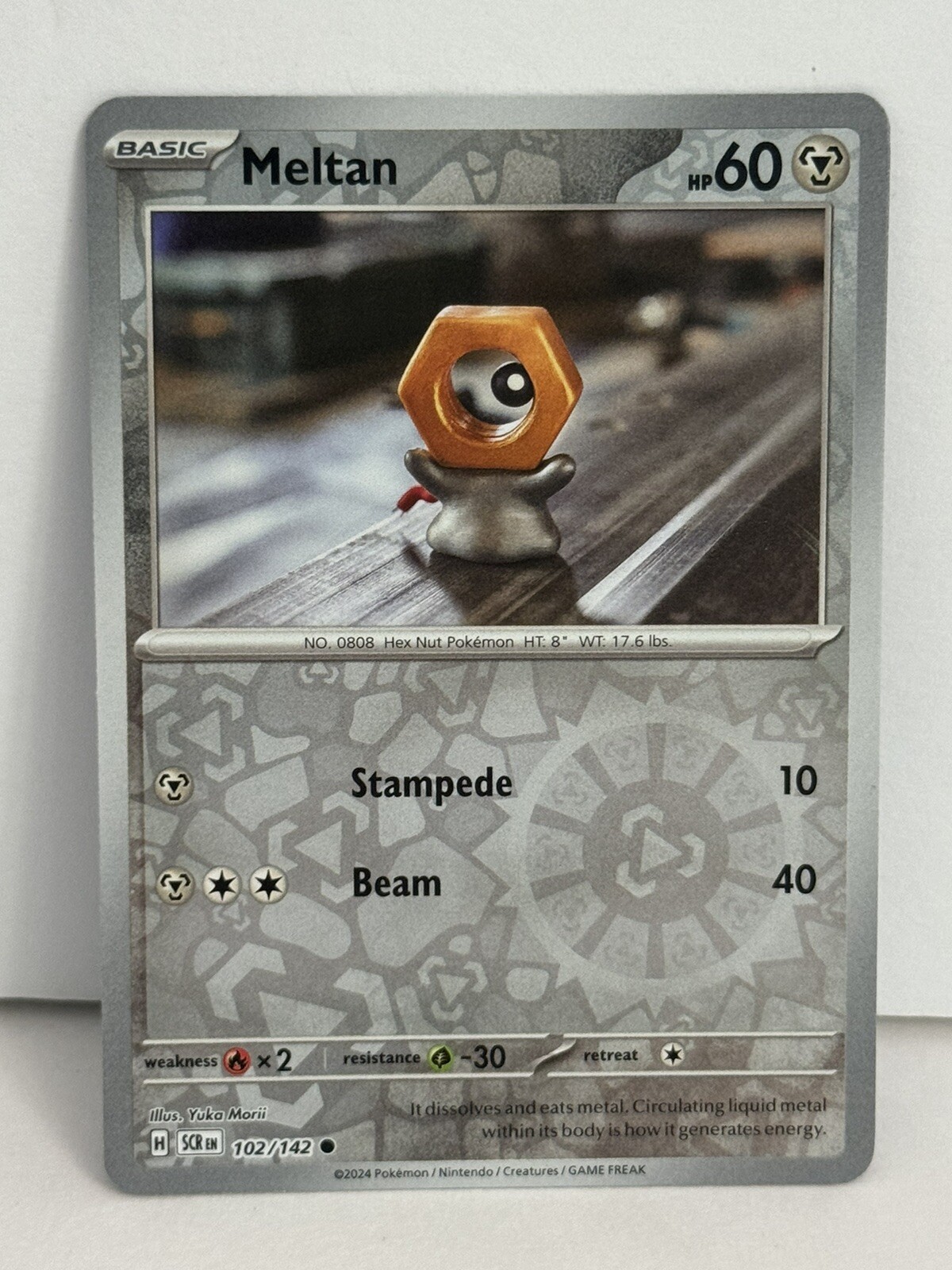 Pokemon TCG Meltan - 102/142 - Reverse Holo - Stellar Crown - NM