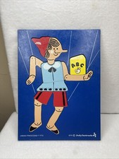 Vintage Judy Wooden Puzzle. Pinocchio 1974. Turquoise Background.