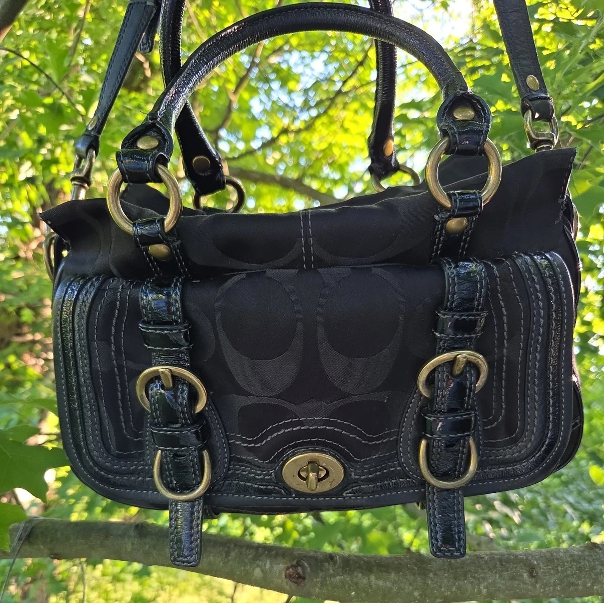 Preços baixos em Bolsas e Sacolas Coach Preto Listrado para