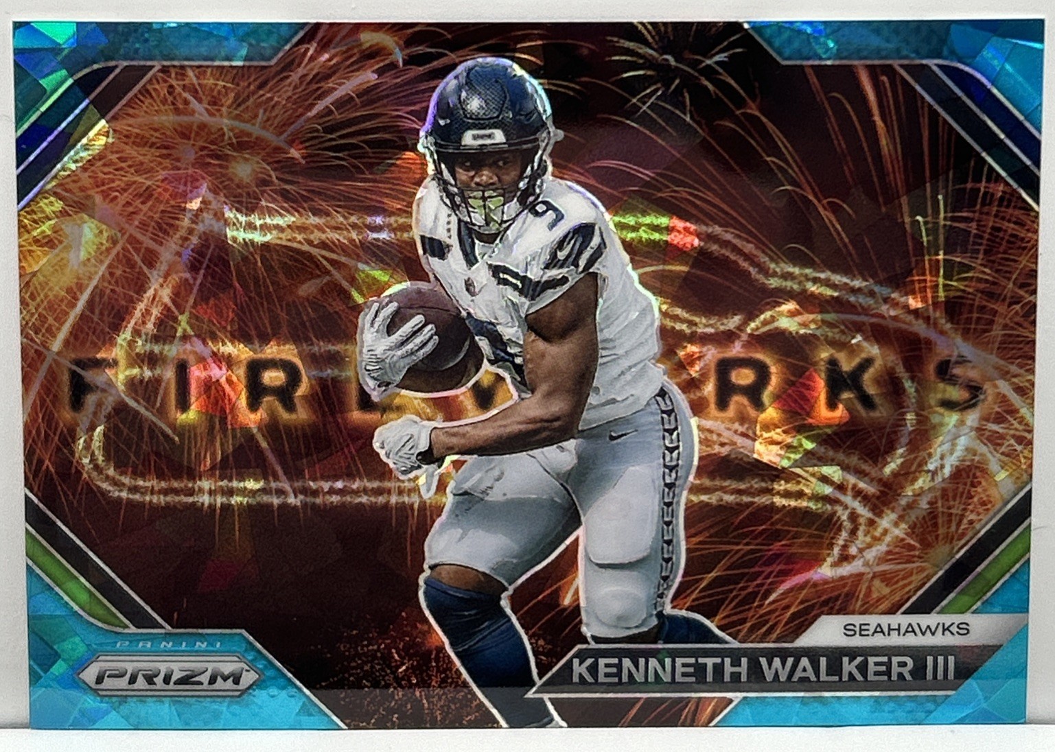 Kenneth Walker III 2023 Panini Prizm Fireworks Blue Ice Prizm /99 #F-14