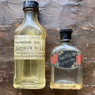 Vintage bottle Arthur Mills Almond oil Full Thwaites & Sons Brilliantine empty.