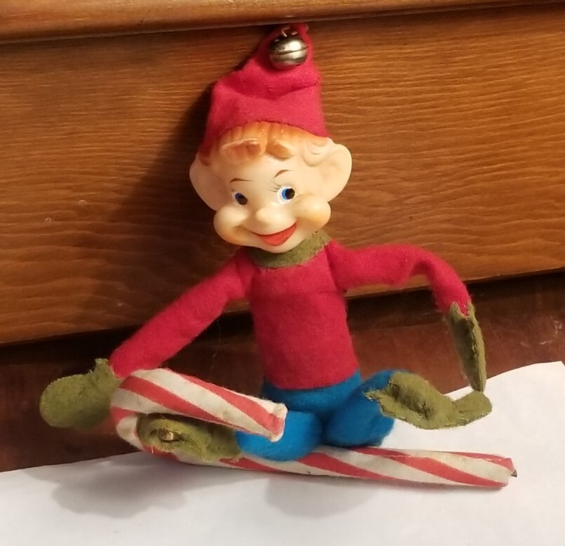 Vintage knee hugger rubber face elf Christmas ornament decoration on candy cane
