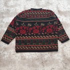 Black knit men's sweater size small with red, green, and white floral and leaf patterns, made in the USA.