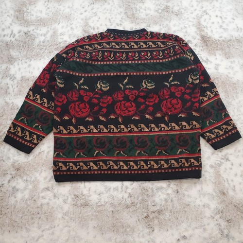 Black knit men's sweater size small with red, green, and white floral and leaf patterns, made in the USA.