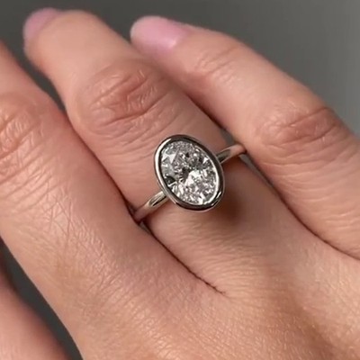 2.24CT Oval Cut Moissanite Bezel Style Engagement Ring In 14K White Gold Plated