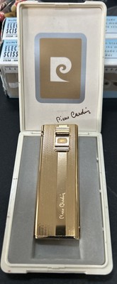 Vintage Pierre Cardin Gold Comet Lighter with Plastic Case.