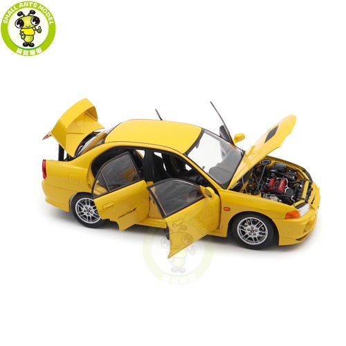 1/18 Motorhelix Mitsubishi Lancer EVO IV amarillo diecast modelo de coche - Imagen 12 de 19
