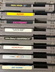 ORIGINAL  NINTENDO NES SYSTEM WITH 21 GAMES AND 2 GAME GENIE BUNDLE.