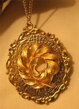 Striking Scalloped Rim Raised Textured Furled Feather Goldtone Pendant Necklace