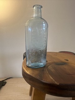 This item is an antique aqua glass bottle Liverpool