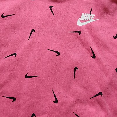 pink nike hoodie with nike all over it