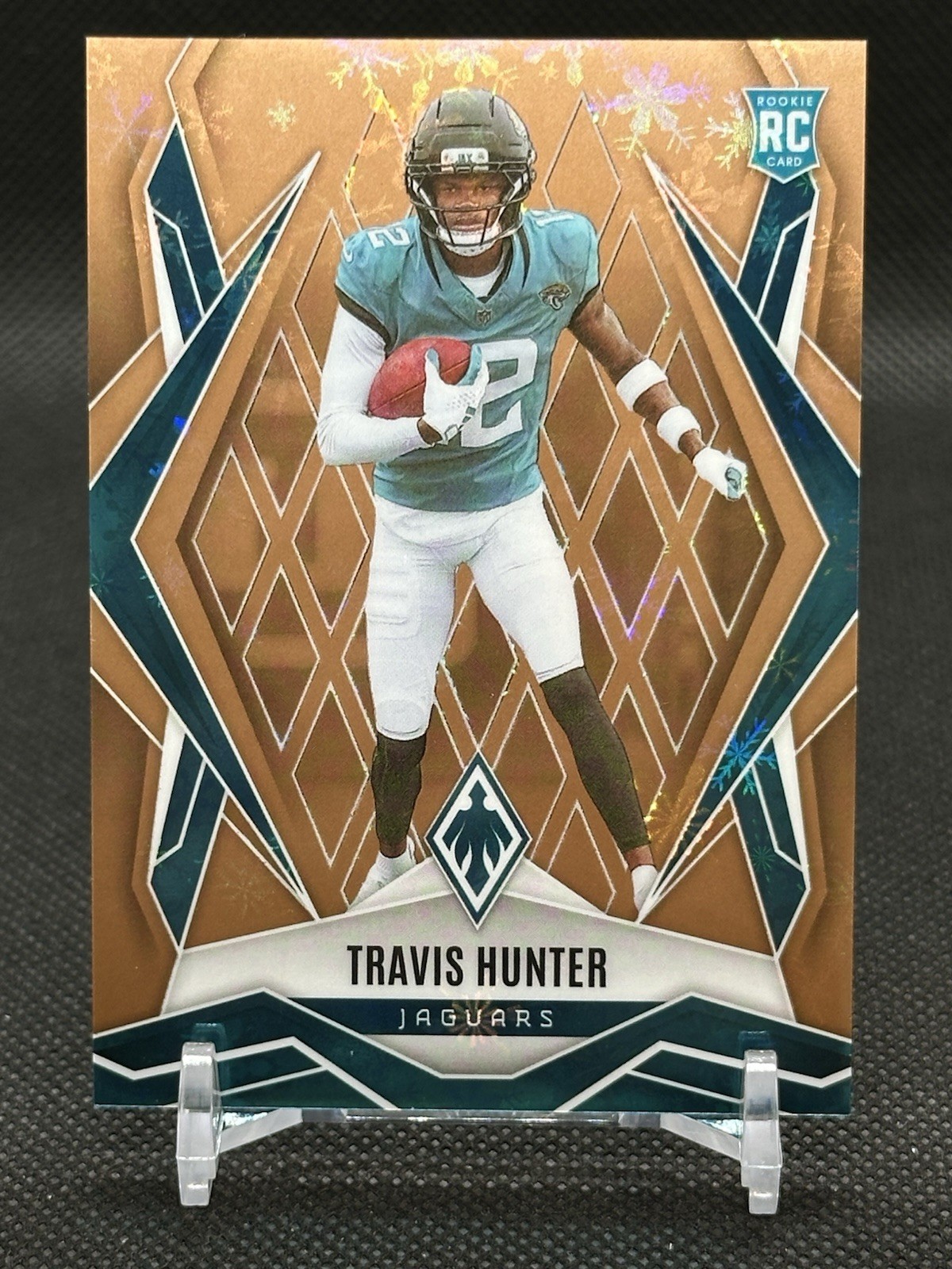 2025 Panini Phoenix - Rookies Travis Hunter #157 Bronze Winter #1/50 (RC)
