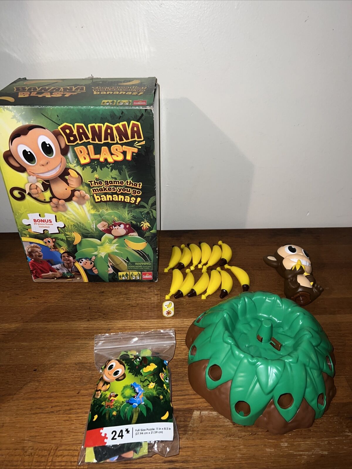 Banana Blast - Pull The Bananas Until The Monkey Jumps Game - Includes a  Fun Colorful 24pc Puzzle by Goliath , Green