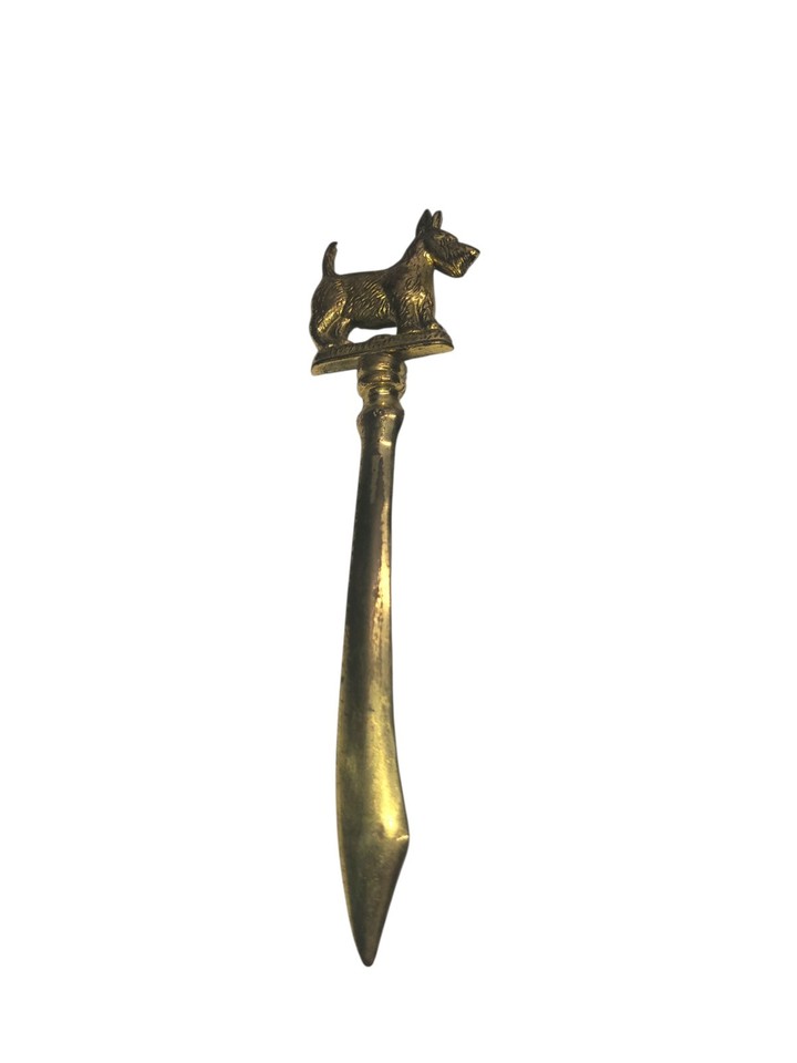 A solid brass Scottie dog letter opener from England — small, charming, and the exact kind of vintage desk trinket that makes people stop and pick it up.
