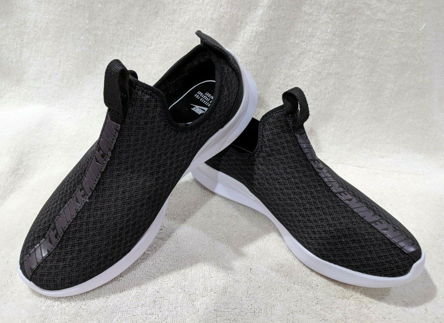 nike black viale slip on