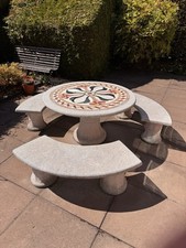 Italian-inspired Solid Stone Weatherproof garden dining Inc. 3 separate benches.