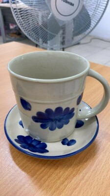 White handmade ceramic mug with tray
