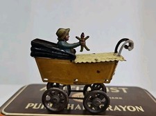 Girl In Yellow Carriage With Toys Stamped GERMANY Tin Penny Toy Meier