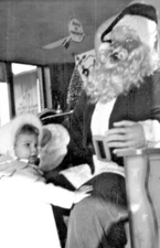 1954 Fake Santa Photo Snap Shot  Cute Little Girl Climbing On Santa Claus's Lap