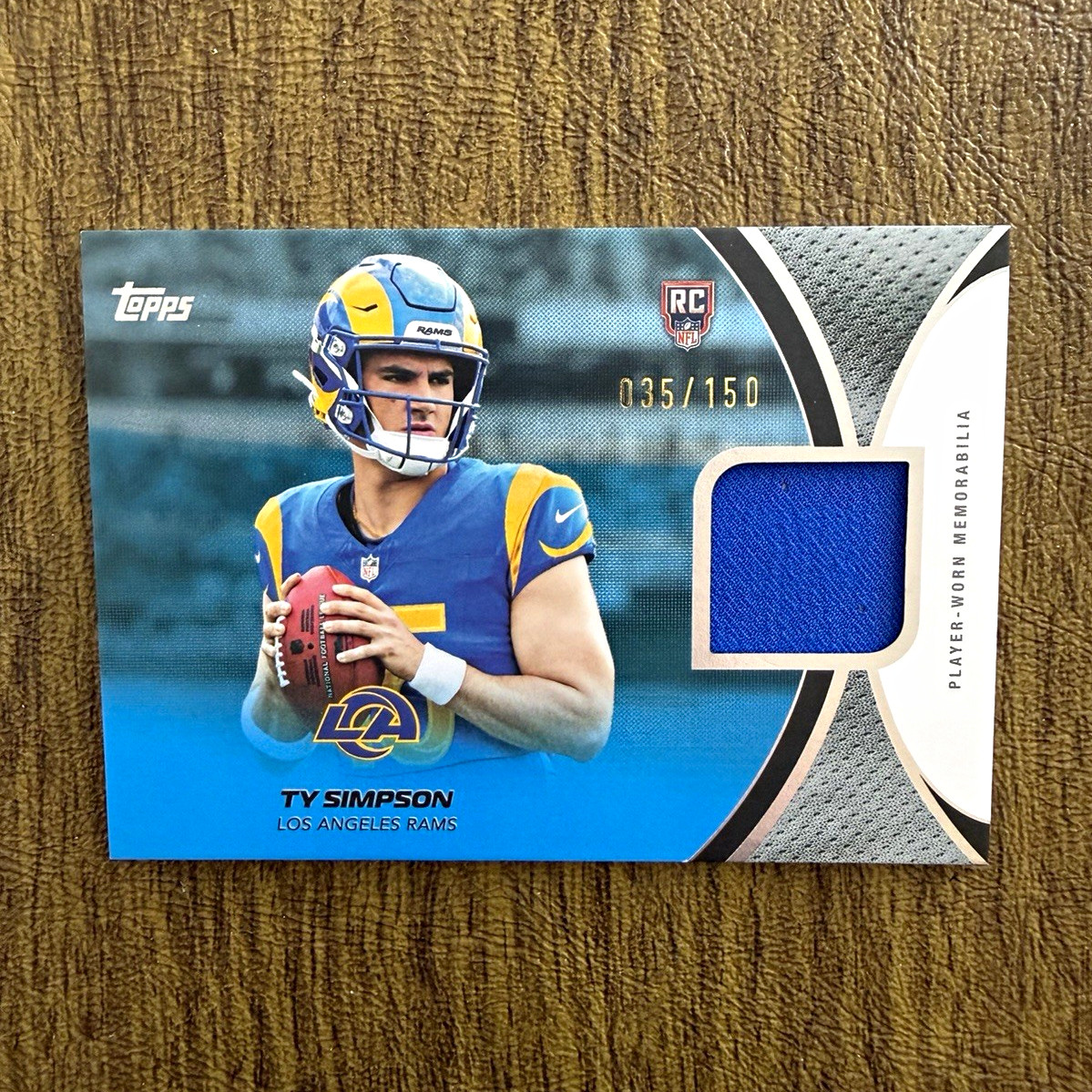 Topps 2026 Flagship Football Ty Simpson Rams NFL Rookies Material RMC-TS /150