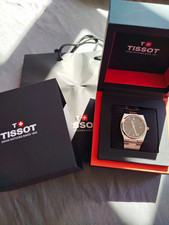 Tissot PRX Quarz Armbanduhr Edelstahl silber blau Datum 100m T137.410