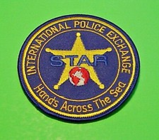 INTERNATIONAL POLICE EXCHANGE  HANDS ACROSS THE SEA  3 1/2"  POLICE PATCH