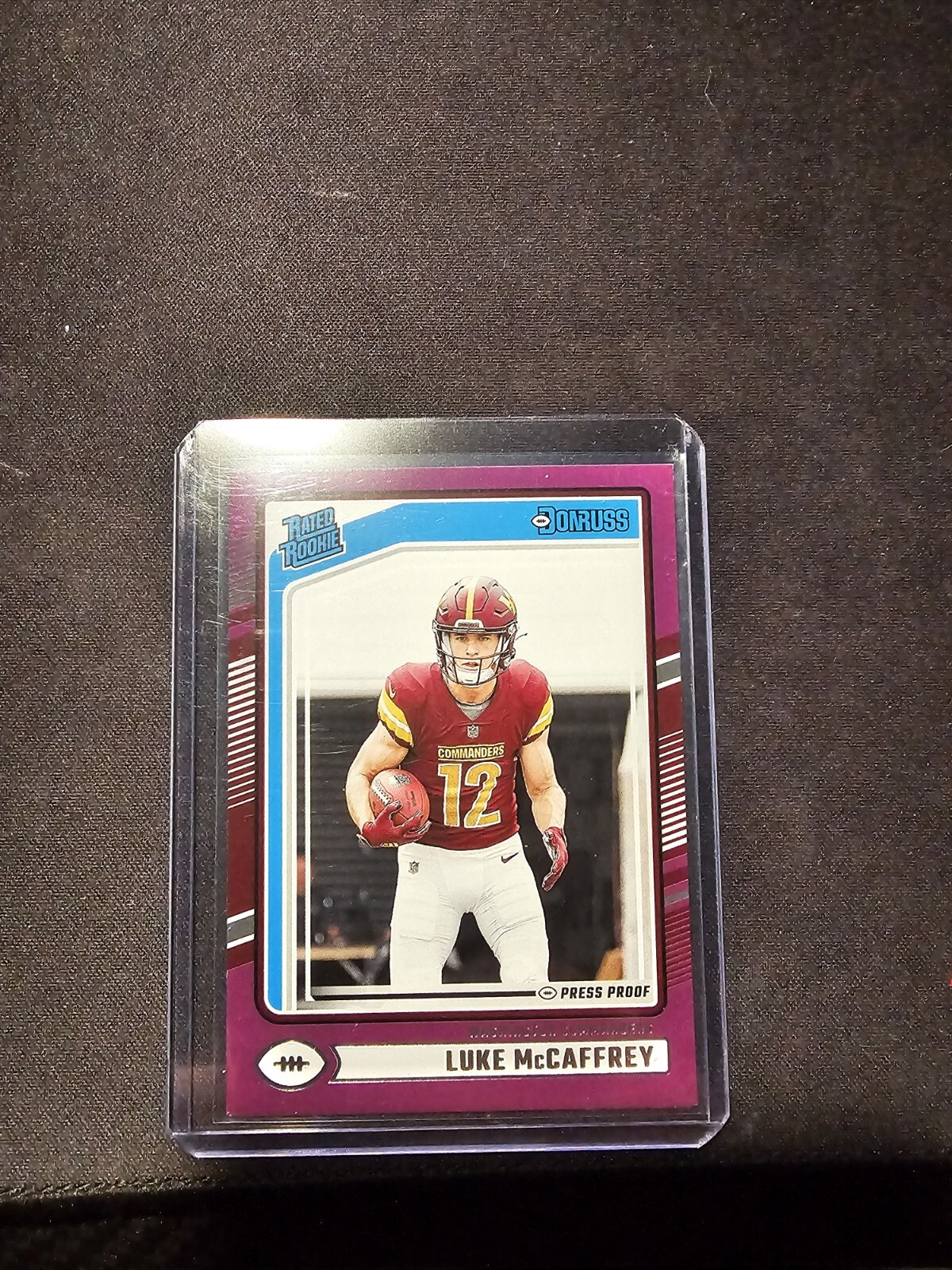LUKE MCCAFFREY 2024 Donruss Rated Rookie PURPLE PRESS PROOF RC #302 Commanders