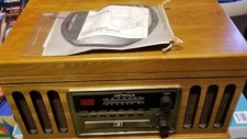 detrola Model KM 837 record player with radio and cassette, spare parts, manual