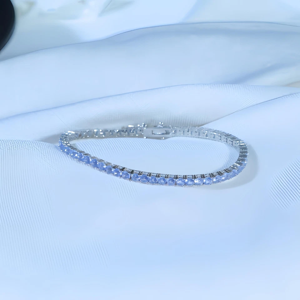 Brazalete de tenis de corte redondo de tanzanita enchapado en oro blanco de 14K de plata de ley 925 Foto 2 de 4