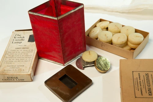 The Kodak Candle Lamp Antique Darkroom Light and candles.