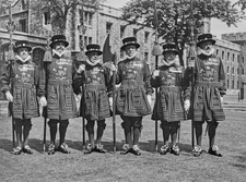 Six Yeoman Warders known as Beefeaters pose their halberd weapons - 1943 Photo