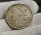 1890 US Morgan Silver Dollar $1 AU (Nicely Toned)