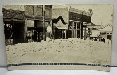 Albion, Nebraska-Street Scene In Winter-Hardware Store-Bike Repair-RPPC Postcard