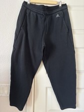 Adidas black sweatpants with drawstring waist and tapered fit