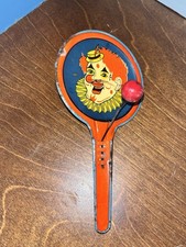 Vintage Tin Clown Paddle Toy Noisemaker Orange Blue Red