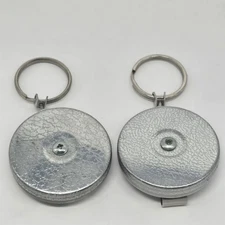 Two Vintage Key Bak Retractable Keychains