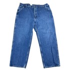 Blue denim Y2K Carhartt men’s carpenter jeans with faded thighs, front pockets, and visible white stitching.