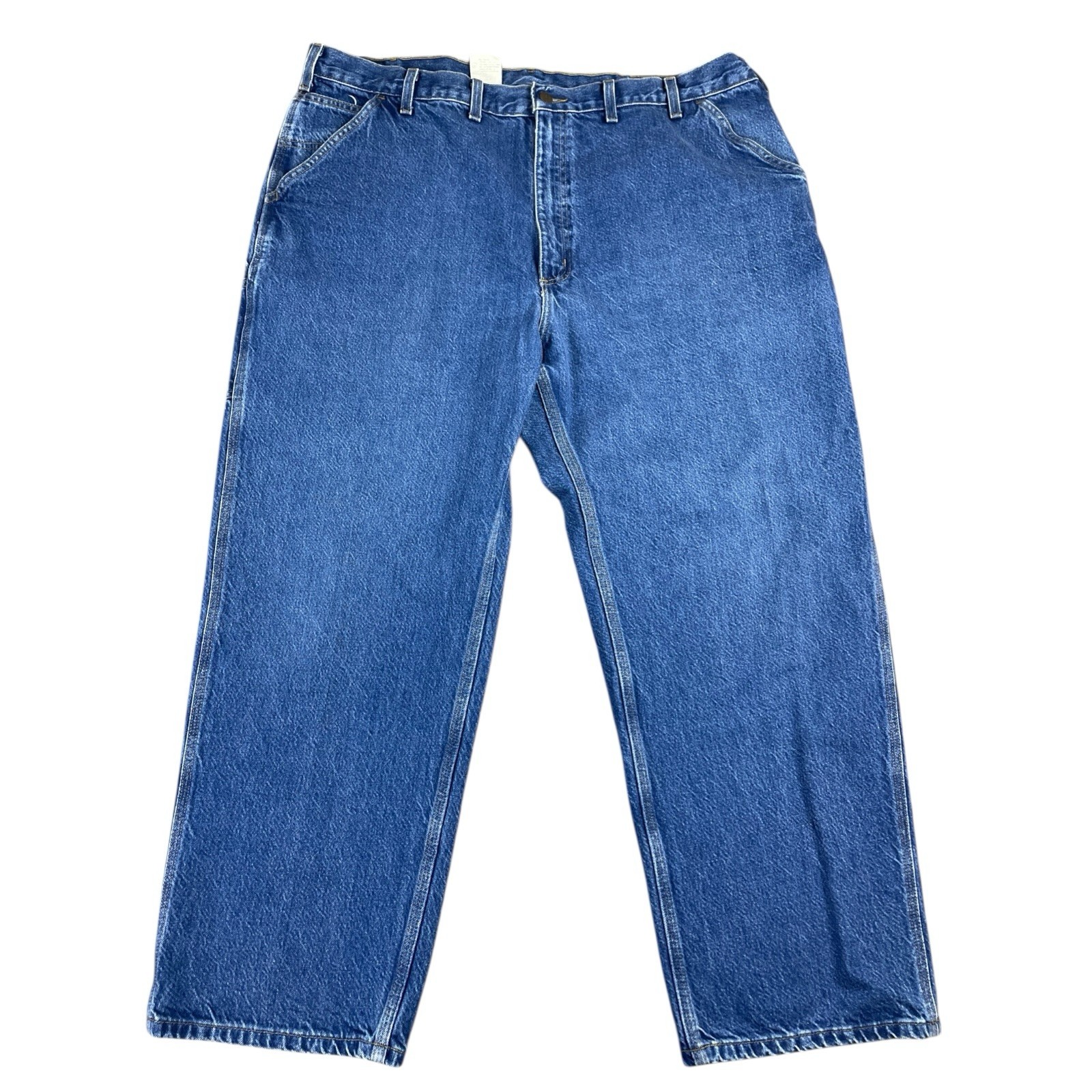 Blue denim Y2K Carhartt men’s carpenter jeans with faded thighs, front pockets, and visible white stitching.