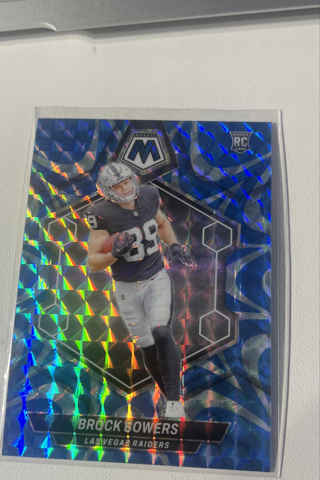 2024 Panini Mosaic - Rookies Brock Bowers #313 Reactive Blue Mosaic Prizm (RC)