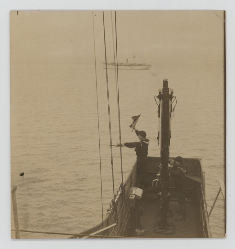 Vintage 1900s US Navy Sailor Signals Ship Using Semaphore Flags Photo HC White